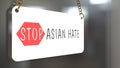 English texts Ã¢â¬ÅStop Asian HateÃ¢â¬Â on label in front of shop, concept for calling international community to stop hurting and